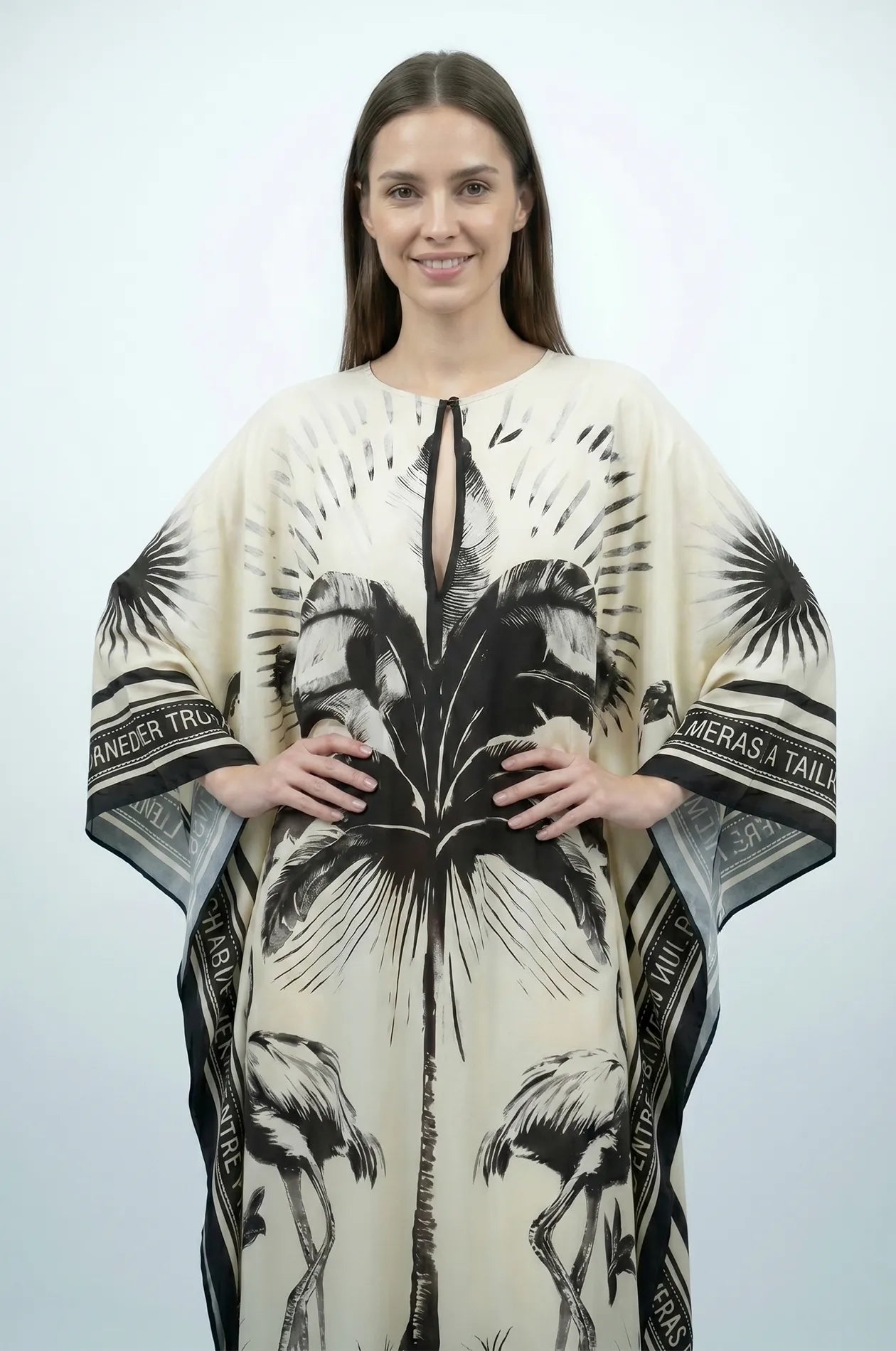 Front detail of Andra flamingo kaftan with palm print and keyhole neckline