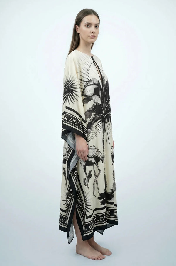Side profile of Andra flamingo kaftan showing flowing drape