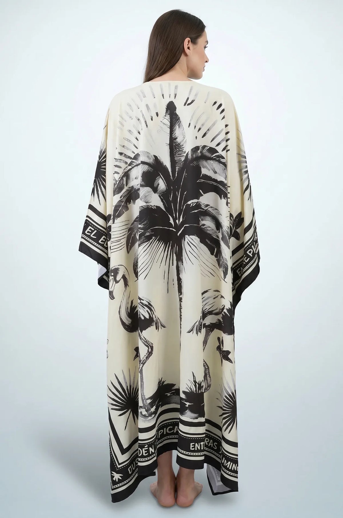 Back view of black and cream flamingo print maxi kaftan