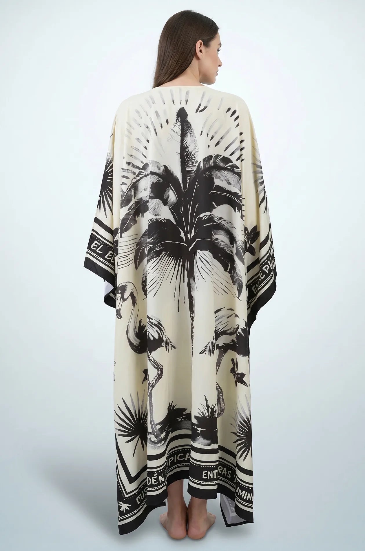 Back view of black and cream flamingo print maxi kaftan