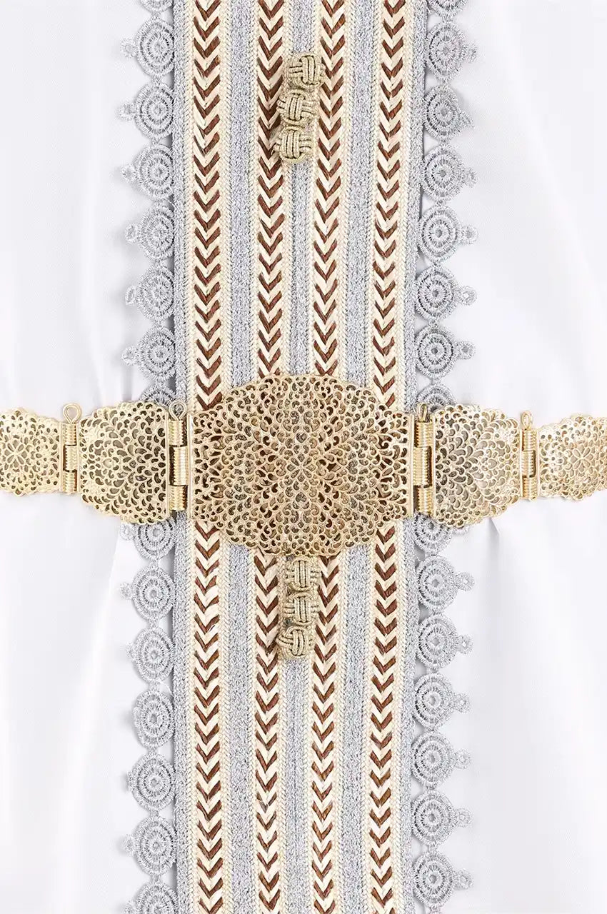 Detail shot of gold filigree belt cinched over a white embroidered Moroccan Kaftan.