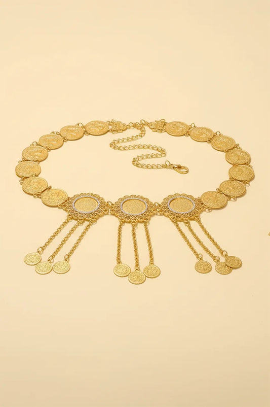Full view of gold coin chain belt showing crystal medallions and hanging coin charms.