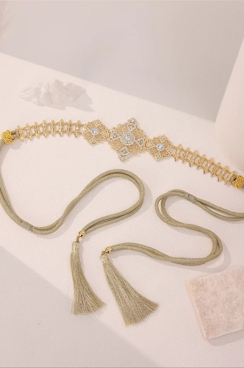 Gold Geometric Rhinestone Link Belt laid flat to showcase the spike design and adjustable closure.