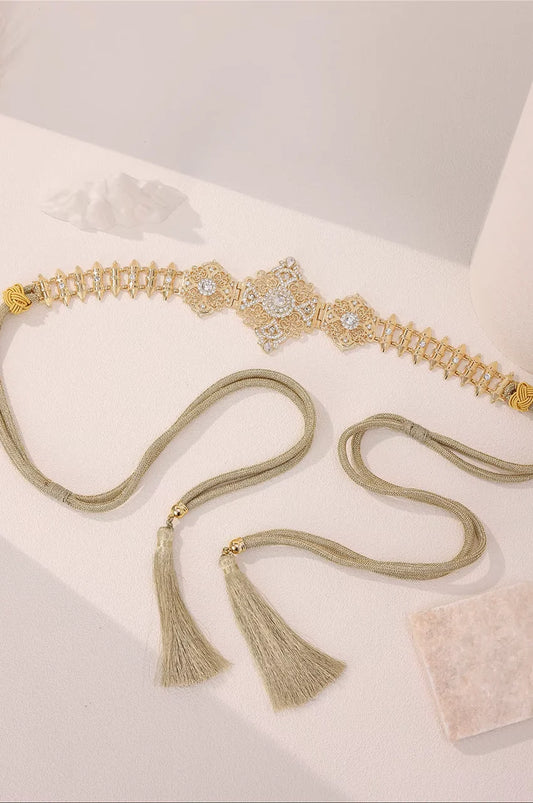 Gold Geometric Rhinestone Link Belt laid flat to showcase the spike design and adjustable closure.