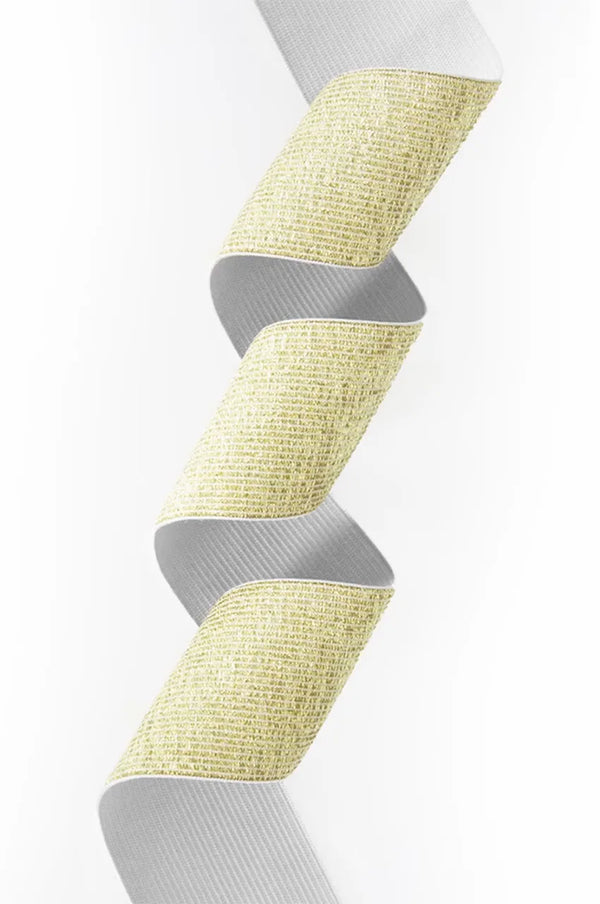 Artistic swirl showing the woven metallic texture of the gold stretch kaftan belt.
