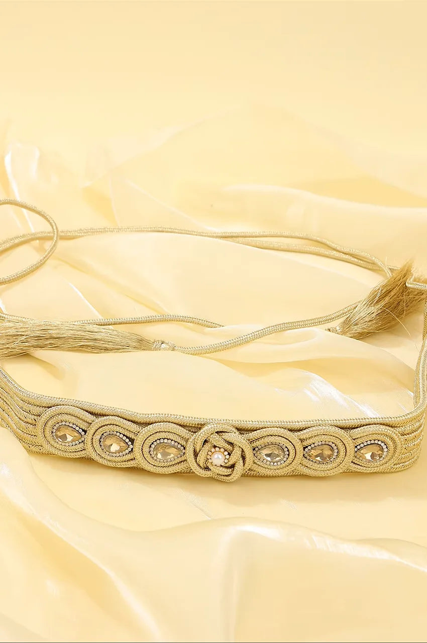 Horizontal view of gold rope kaftan belt showing woven texture and crystal floral centerpiece.