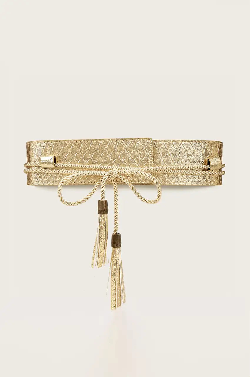 Front view of wide gold belt showing knotted rope closure and hanging tassels.