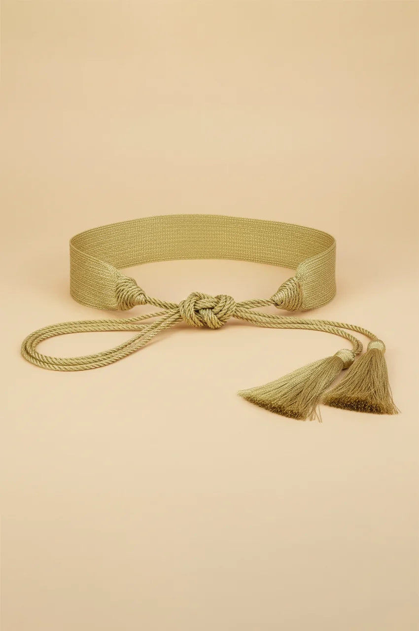 Front view of the gold woven sash belt with braided rope ties knotted in the center.