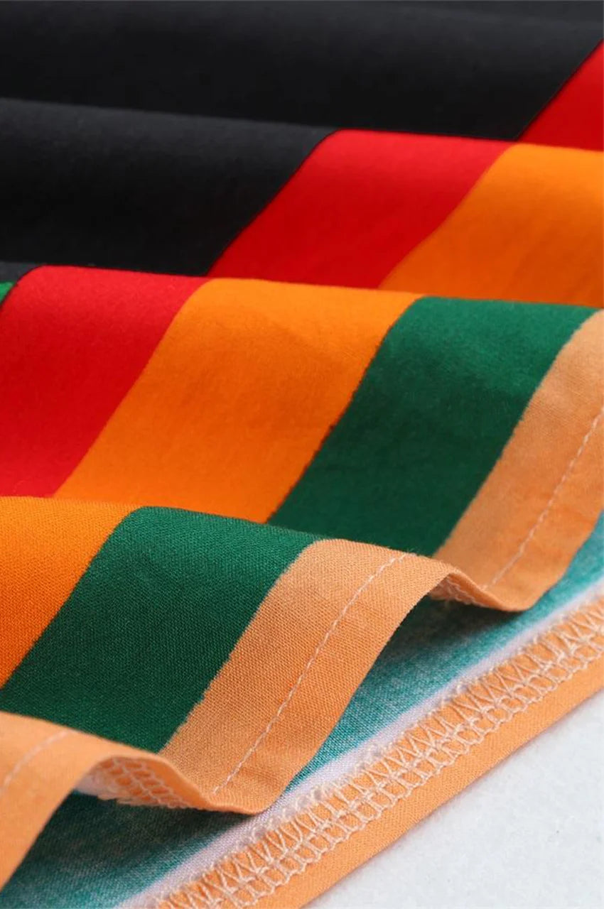 Stitching and hem detail of green printed kaftan dress fabric