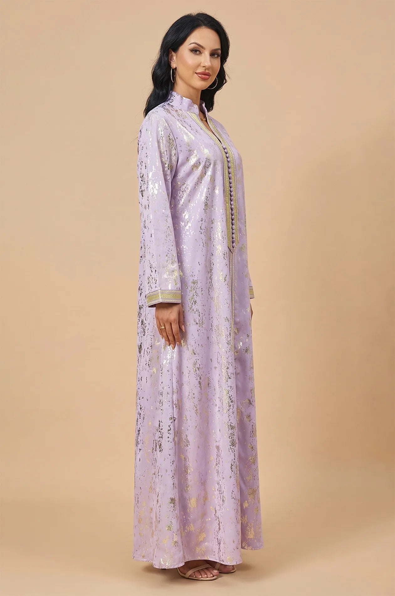 Side profile of the flowing Halim lilac glamorous kaftan.