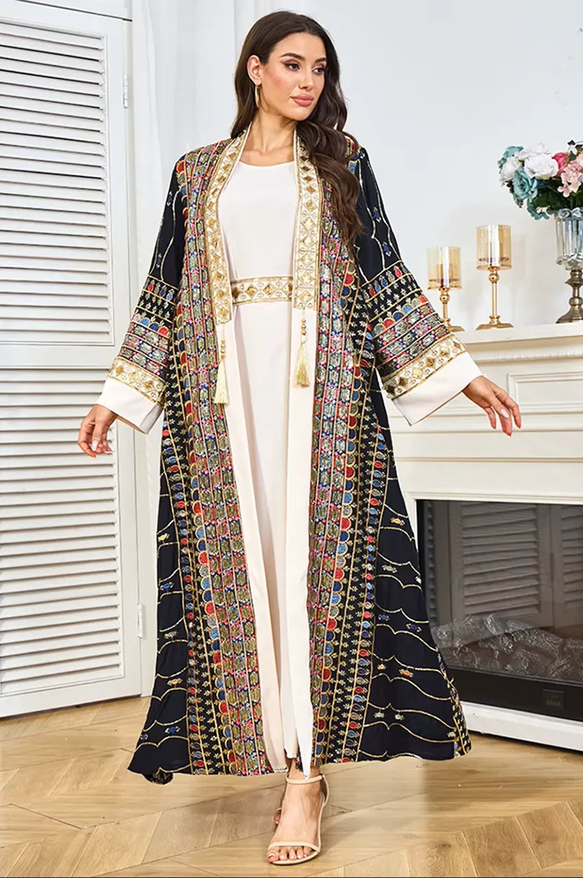 Lifestyle shot of the black plus size sequin kaftan styled for an evening gala or formal Eid celebration.