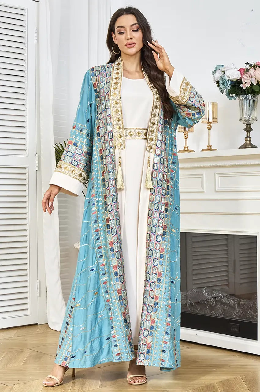 Full-length shot demonstrating the flattering A-line silhouette of the sky blue plus size sequin kaftan.