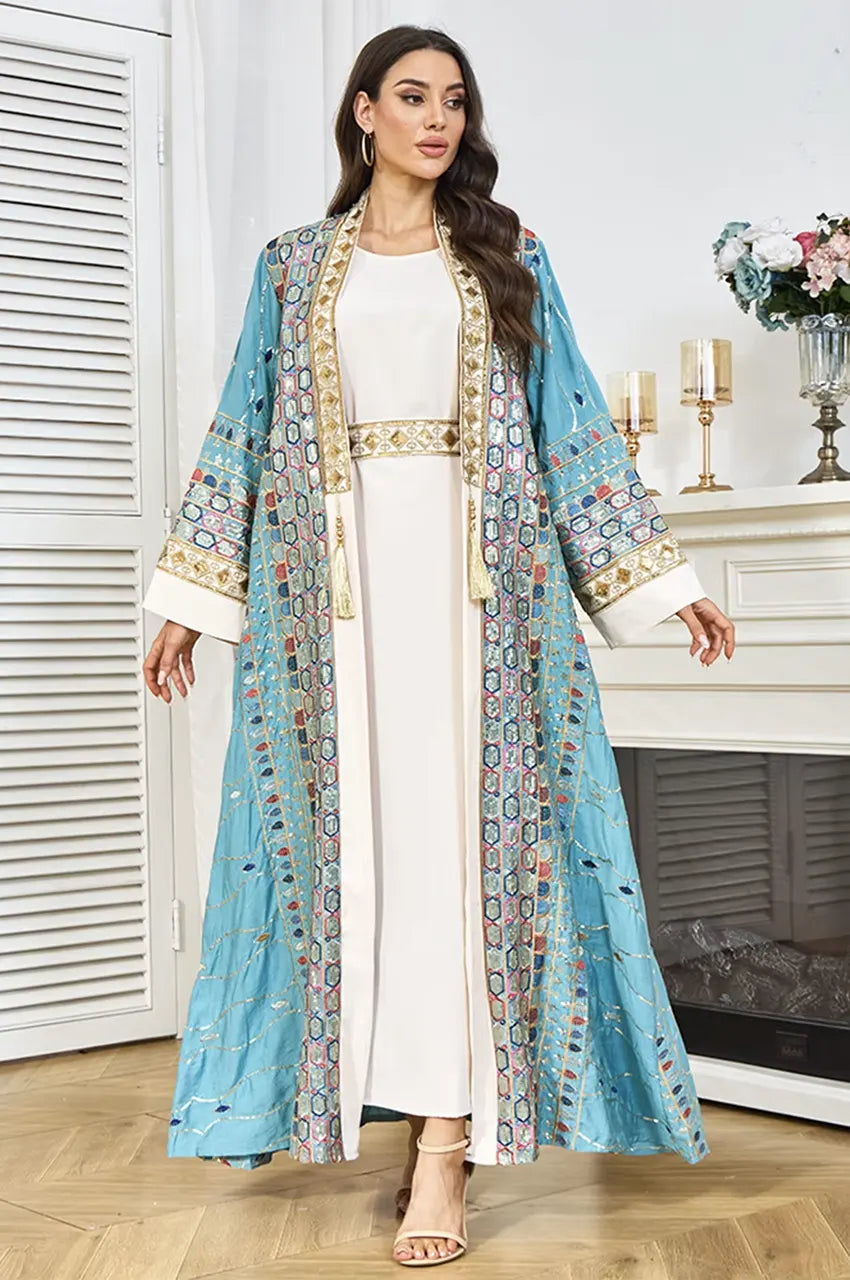 Detailed view of the gold and white detachable rope belt with tassels on the plus size sequin kaftan.