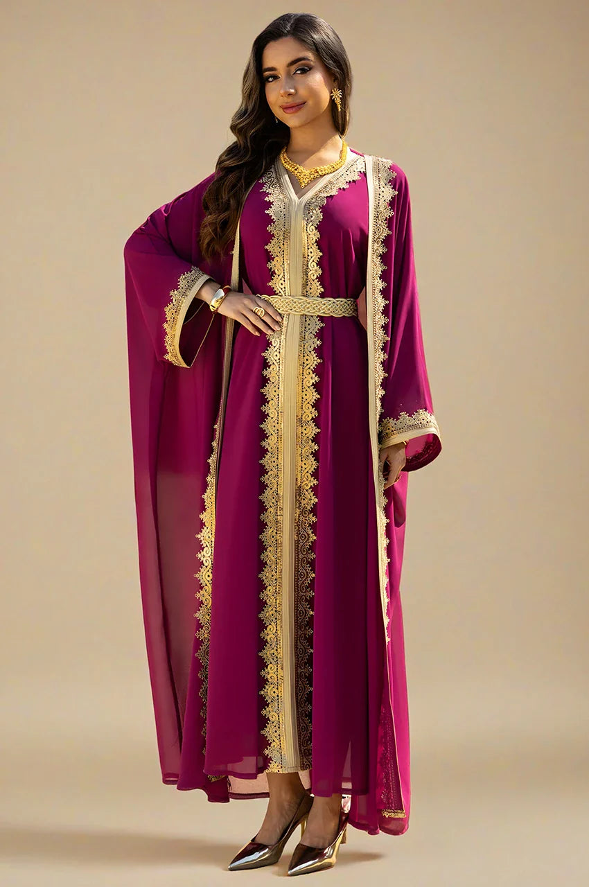 Angled front view of the NAYRA hot pink 2-piece long sheer kaftan showing the gold belt.