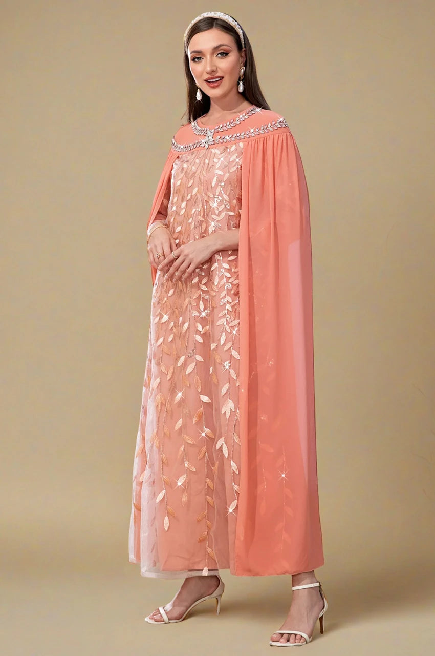 Peach Goddess Kaftan by Ilana – angled view showing shimmering embroidery and cape drape