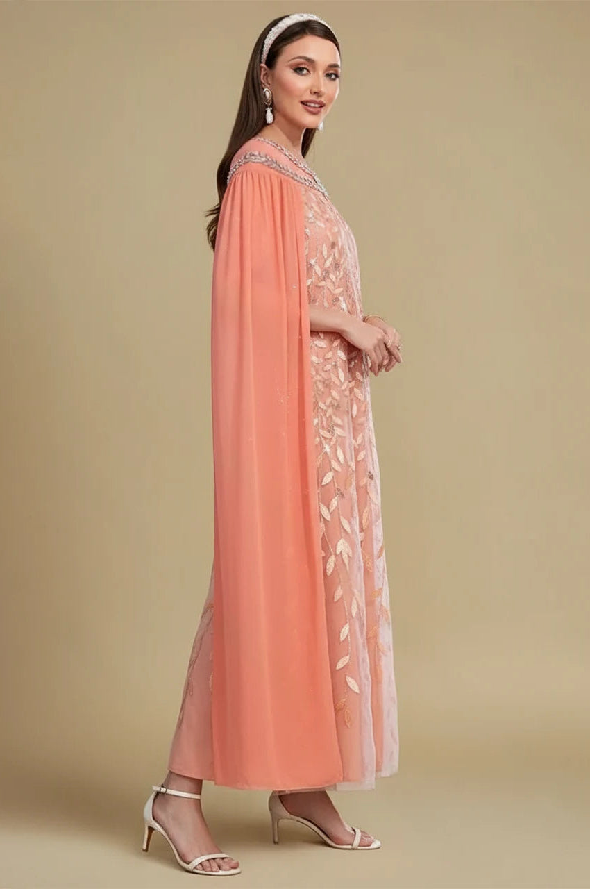 Side profile of Ilana Goddess Kaftan in Peach with flowing cape silhouette