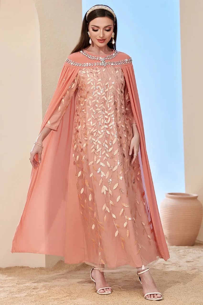 Side view of Ilana Peach Goddess Kaftan with flowing chiffon cape