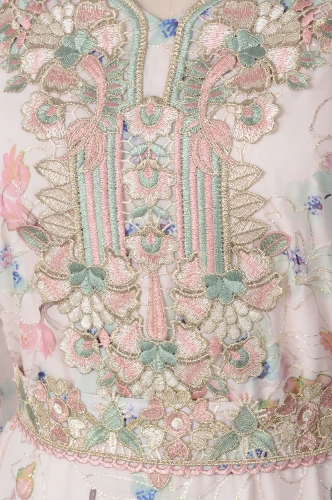 Close-up of the intricate pink and gold embroidery on the Ilani kaftan bodice.