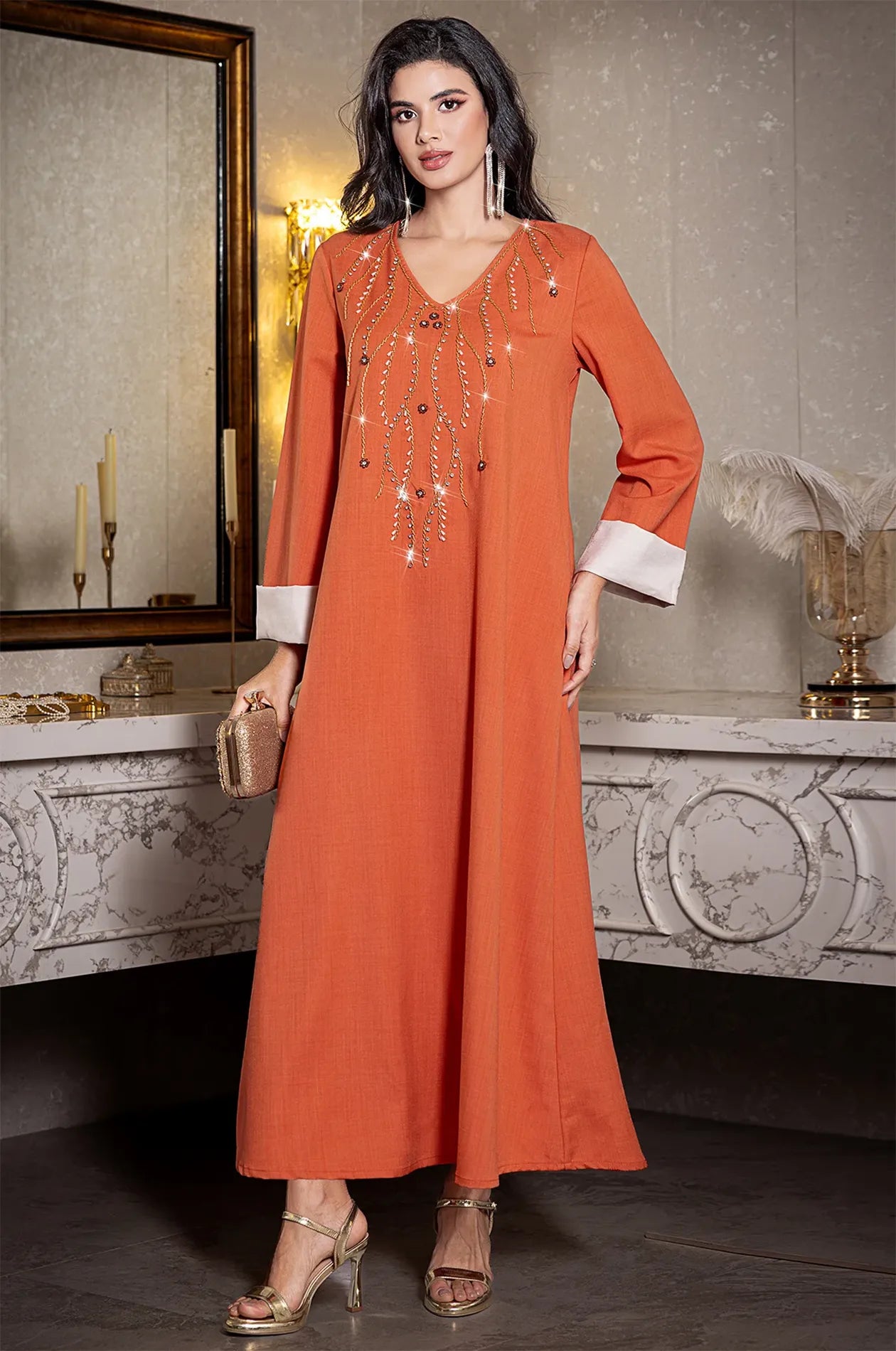Glamorous full-length shot of the Ilena orange kaftan for formal event inspiration.