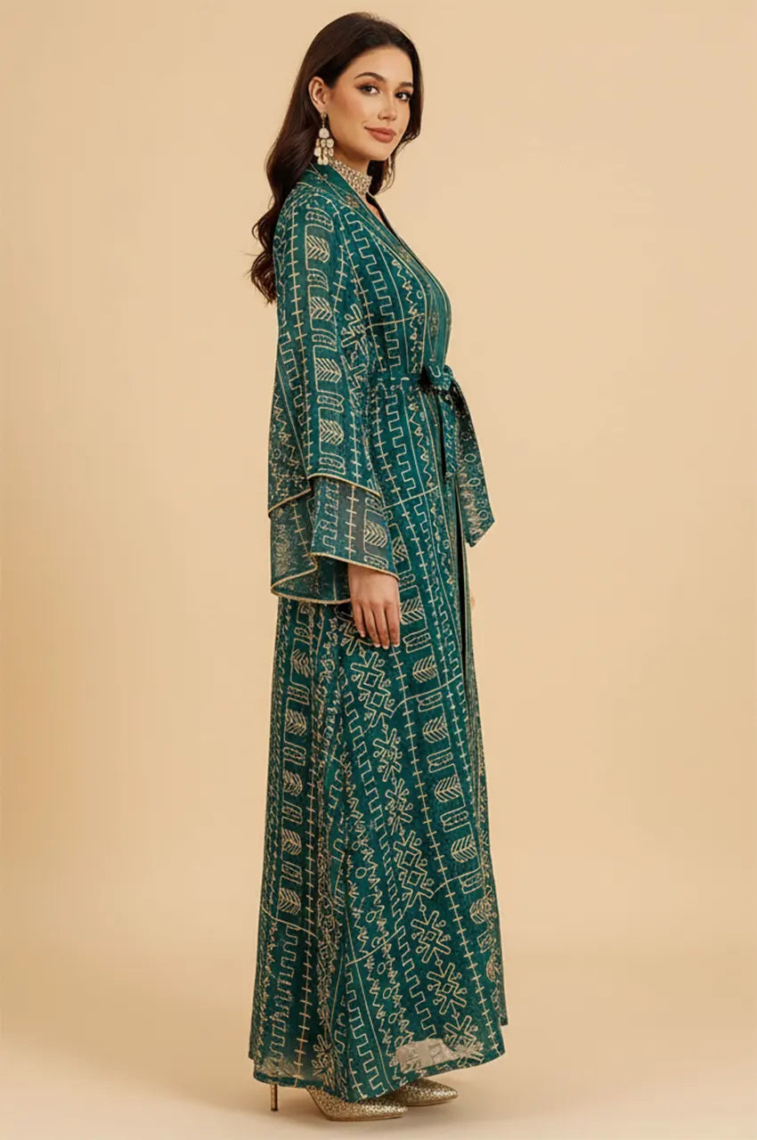 Side profile of the emerald green embroidered belted kaftan dress showcasing the 2-piece layering.