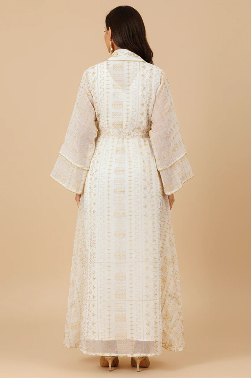 Back view of the ILYAH ivory white embroidered belted kaftan dress showing floor-length drape.