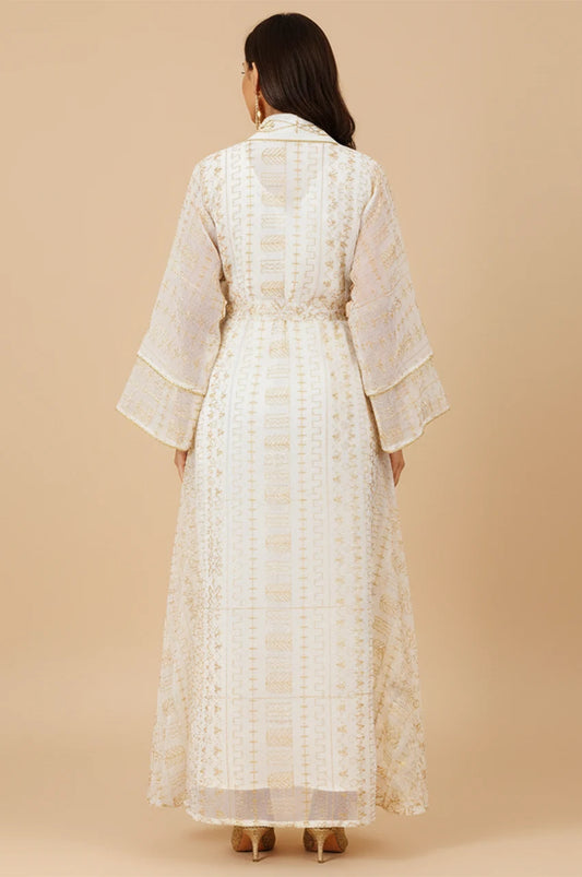 Back view of the ILYAH ivory white embroidered belted kaftan dress showing floor-length drape.