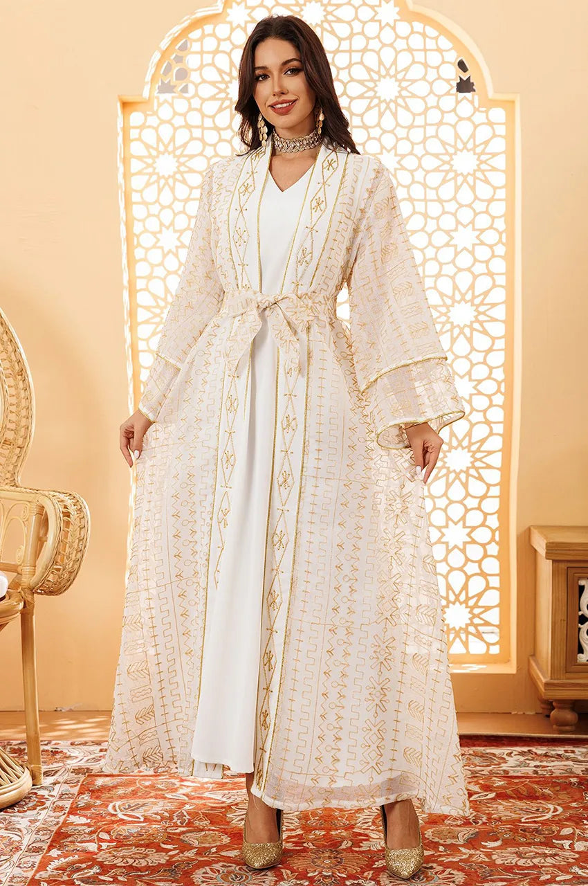 Front view of ILYAH ivory white embroidered belted kaftan dress with gold geometric motifs.