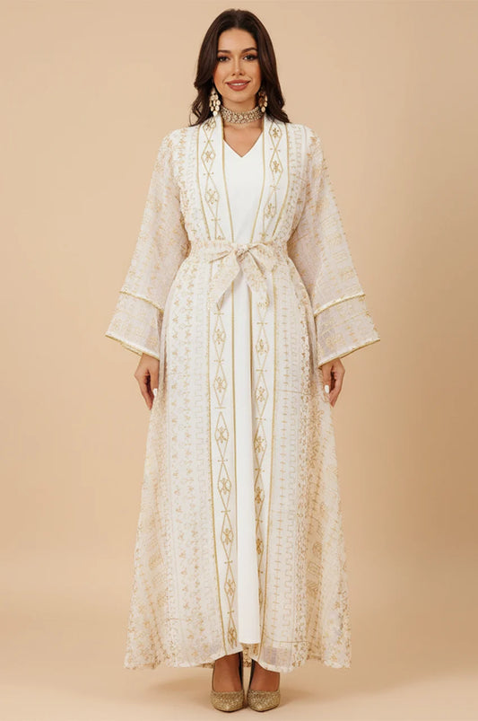 Professional studio shot of the ILYAH ivory white embroidered belted kaftan dress.