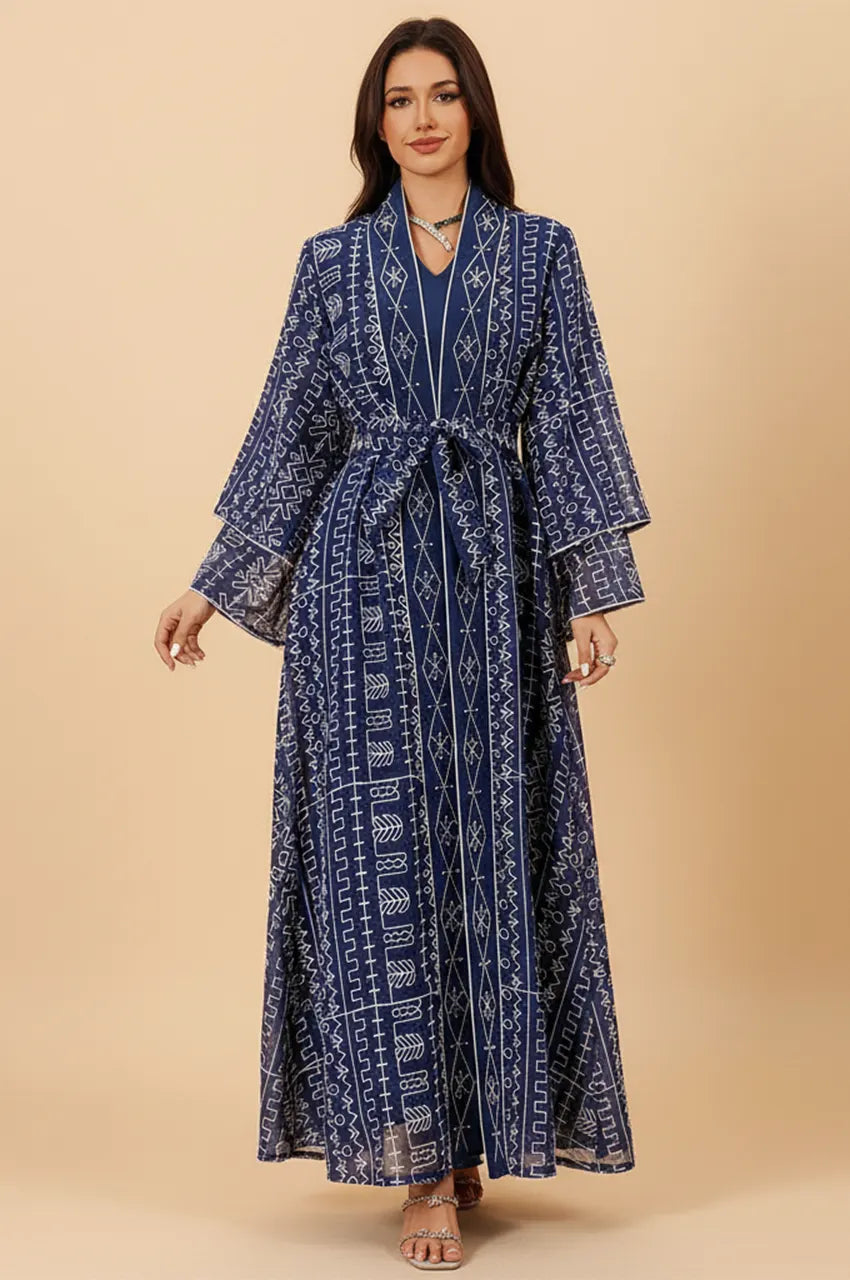 Front view of ILYAH midnight blue embroidered belted kaftan dress with white geometric stitching.