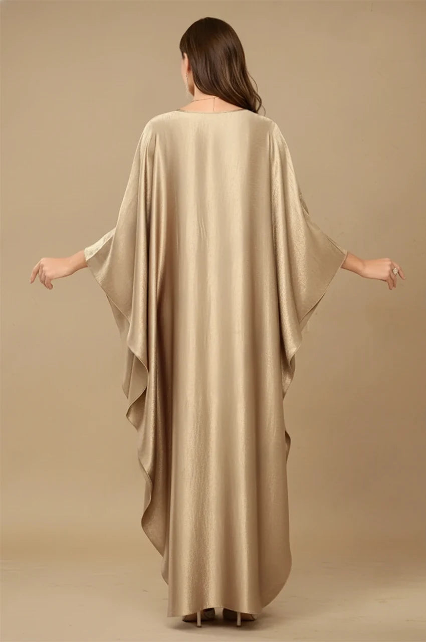 Back view of Inara gold batwing kaftan with flowing metallic fabric