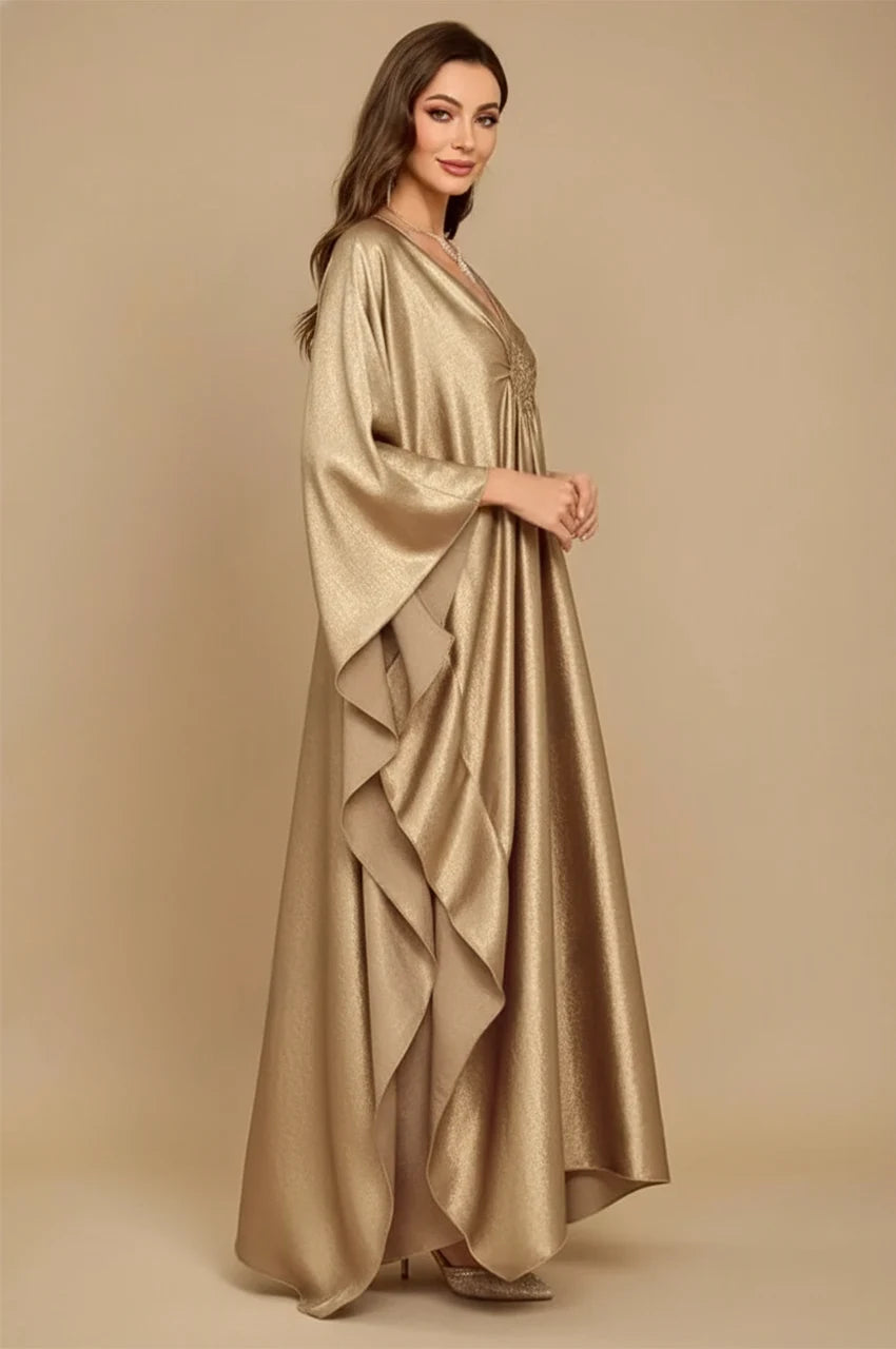 Inara gold batwing kaftan side view with draped sleeves and metallic shine