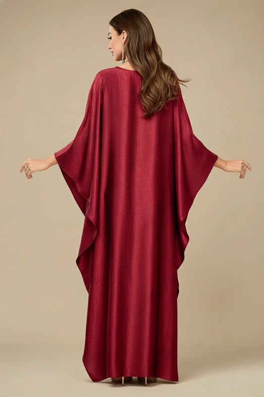 Inara red batwing kaftan back view with flowing draped sleeves and metallic satin finish