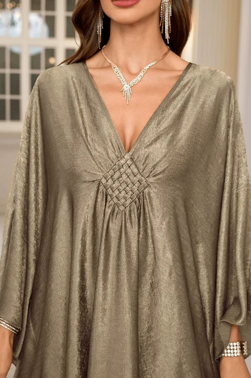 Close-up of Inara silver batwing kaftan with pleated V-neck detail