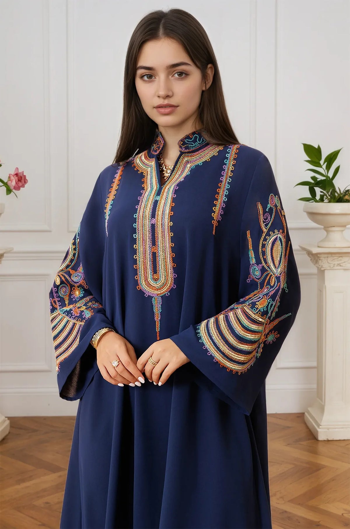 Mid-shot of the Inez Blue Jalabiya Kaftan focusing on the intricate multi-colored needlework on the collar and chest.
