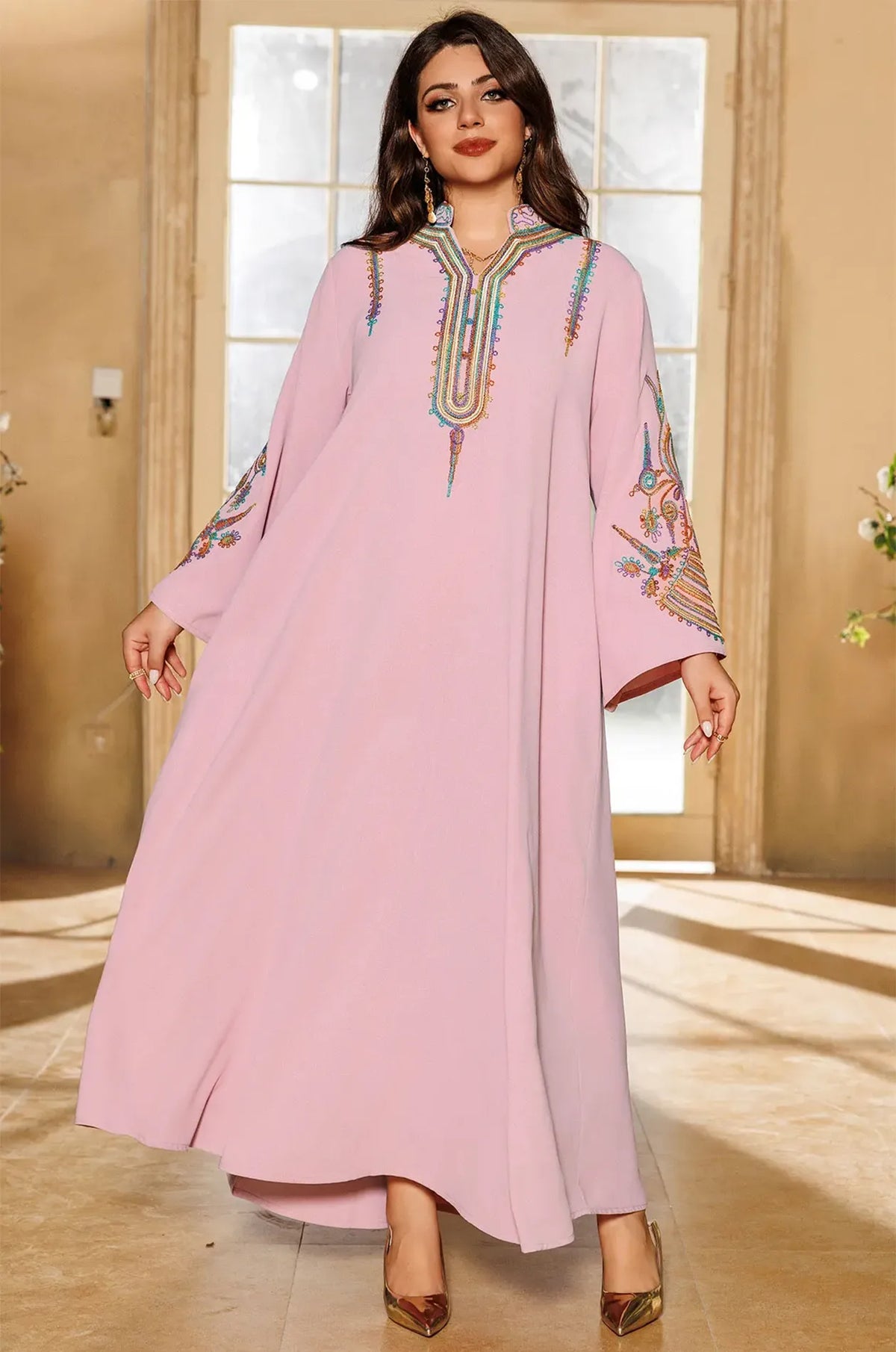 Full-length shot of the Inez Pink Jalabiya Kaftan highlighting its flowing A-line cut and vibrant chest embroidery.