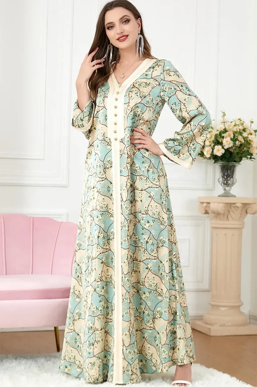 Model wearing the Isara green floral casual Moroccan kaftan, a perfect choice for modest resort wear from Naylara.