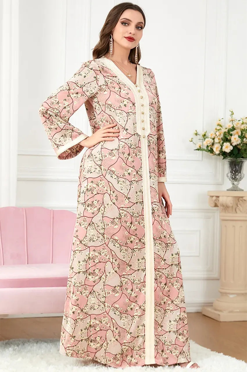 Model posing in the Isara pink bohemian-style kaftan, ideal for luxury resort wear and summer vacations