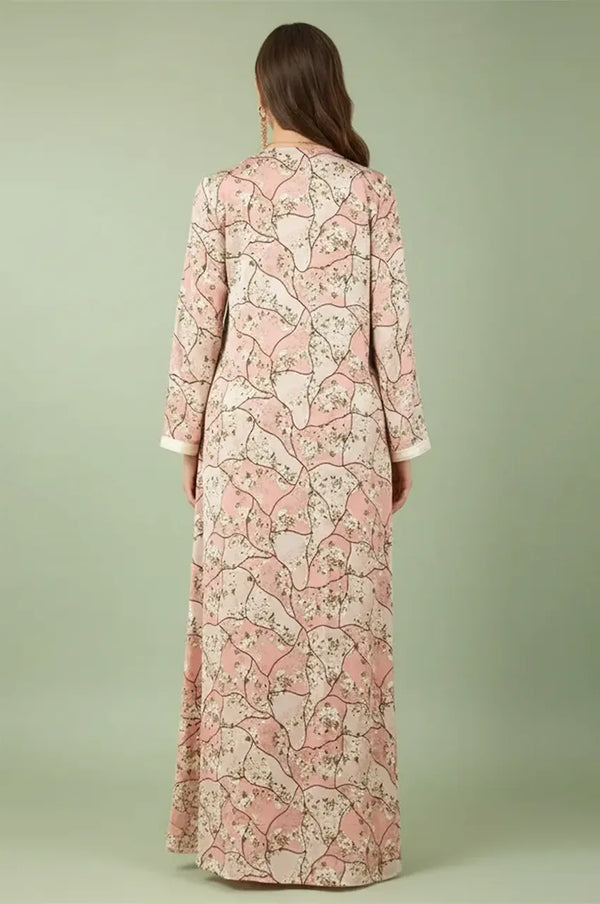 Back view of the Isara pink casual Moroccan kaftan showing the continuous floral pattern and maxi silhouette.