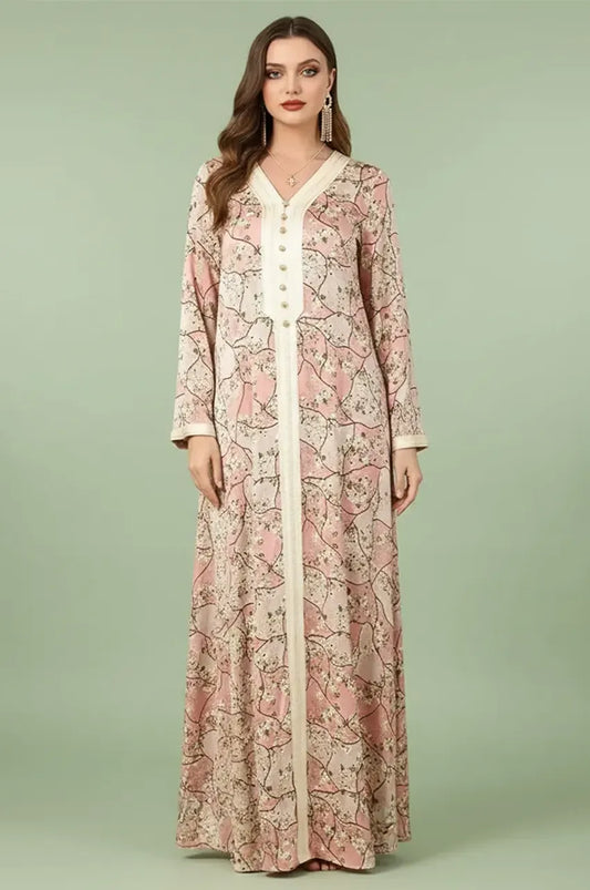 Front full-length view of the Isara pink casual Moroccan kaftan with floral print and ivory Sfifa trim.