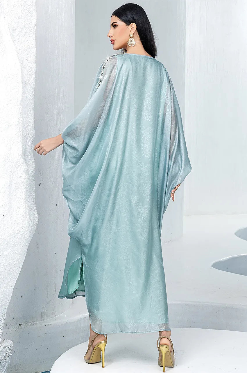 Rear angle showing the fabric drape and texture of the light blue Jalya dress
