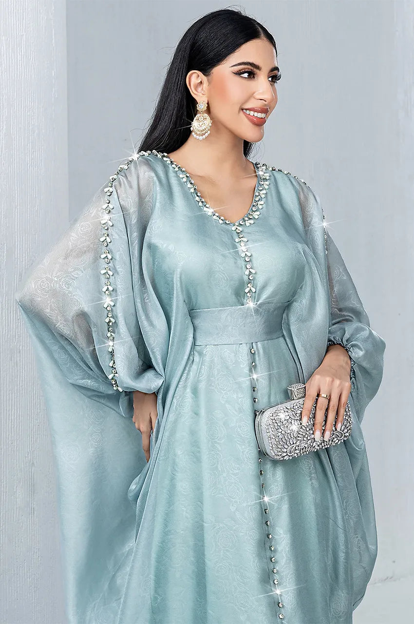 Close up of silver crystal beadwork on the Jalya light blue kaftan neckline