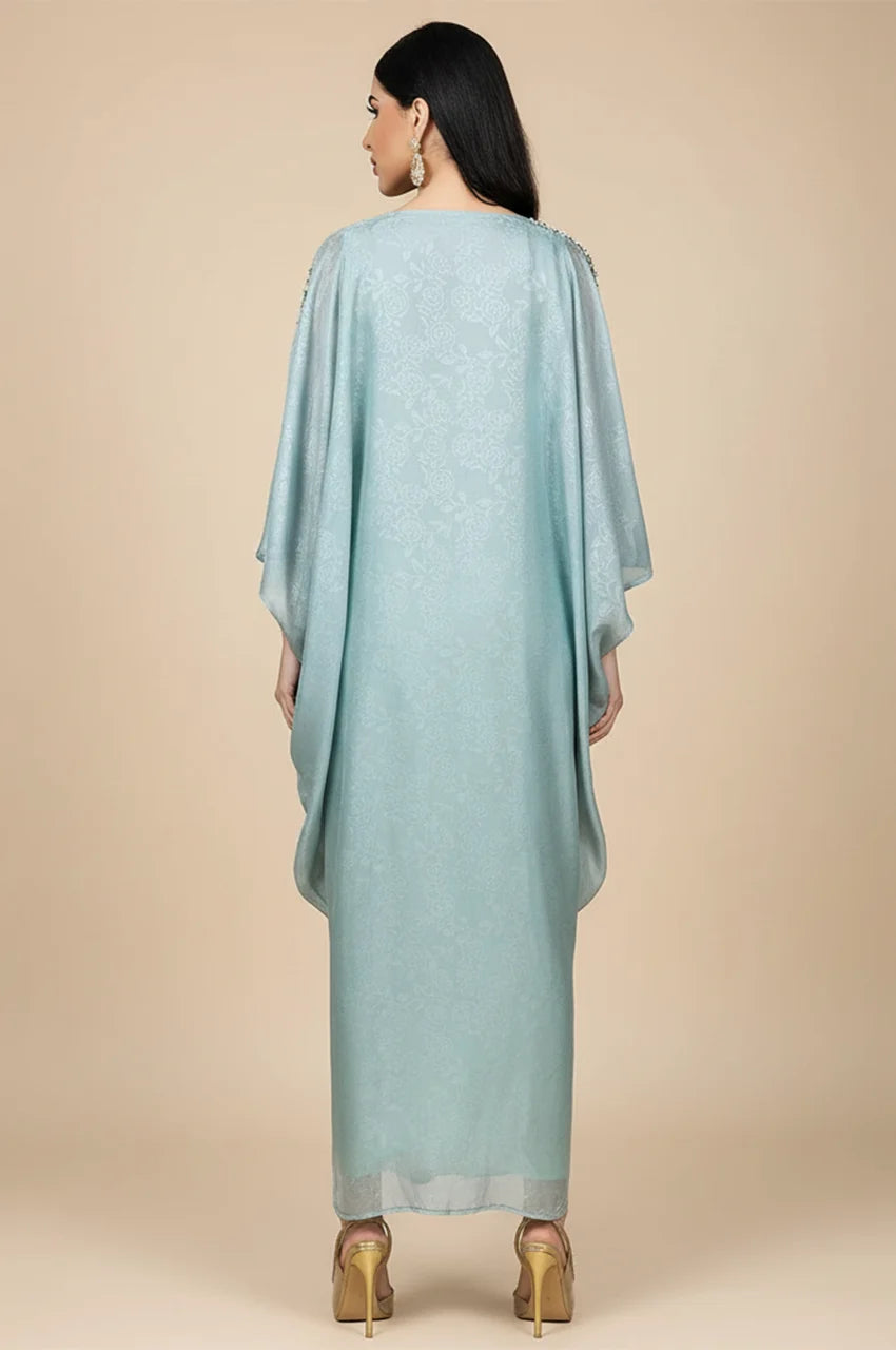 Back view of the light blue butterfly cut kaftan showing jacquard texture