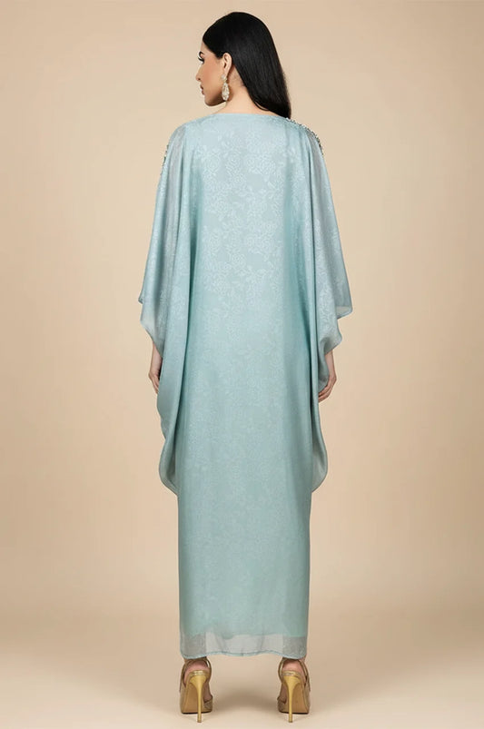 Back view of the light blue butterfly cut kaftan showing jacquard texture