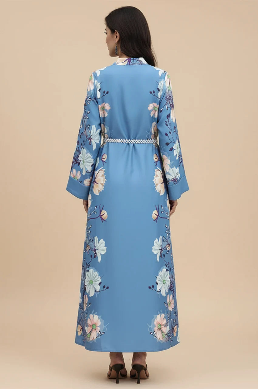 Full length back view of the Janel floral print dress in sky blue.