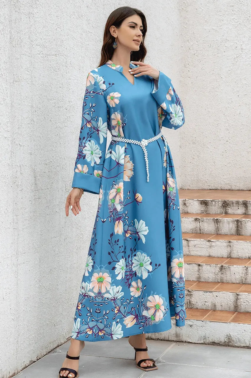 Detail shot of wide tailored cuffs on the Janel luxury floral kaftan.