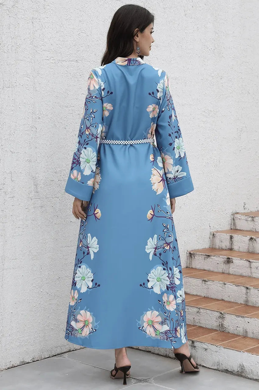 Back view of long sleeve floral maxi kaftan showing fluid drape.