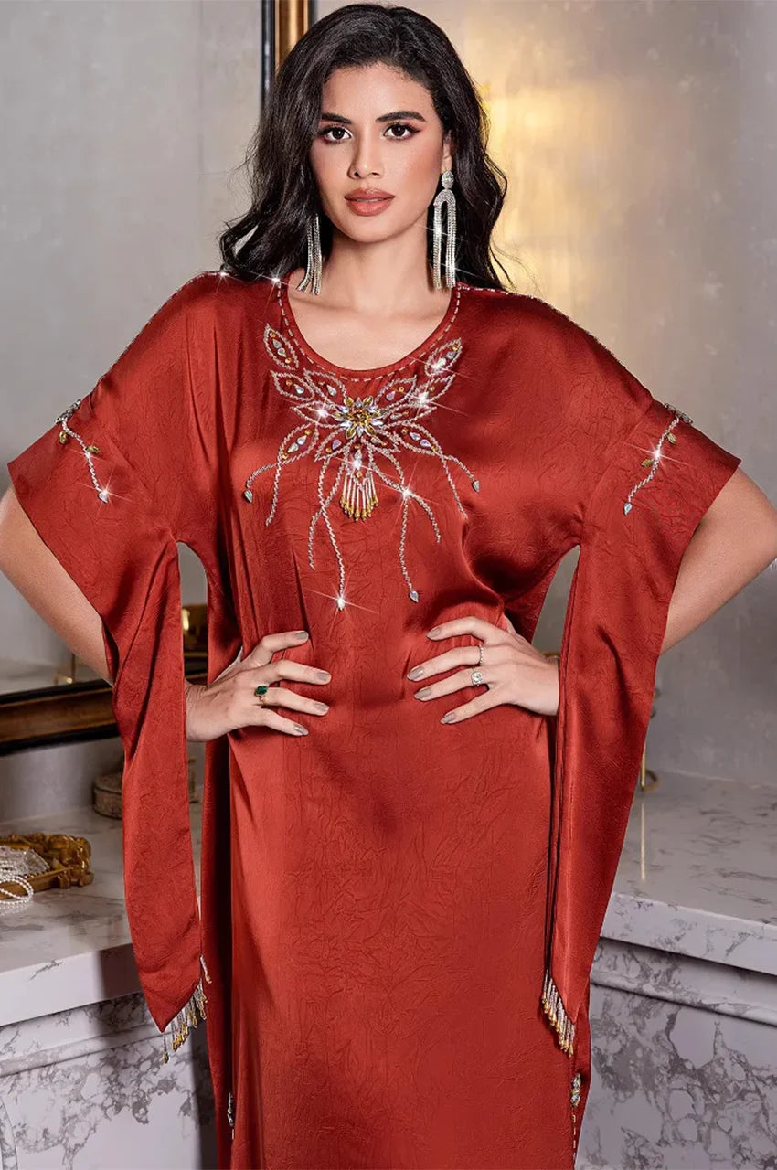 Close-up of butterfly crystal embroidery on Jasira Kaftan