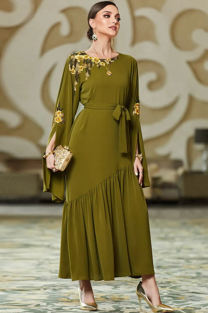 Close up of the gold floral embroidery on the shoulder of the olive green dress.