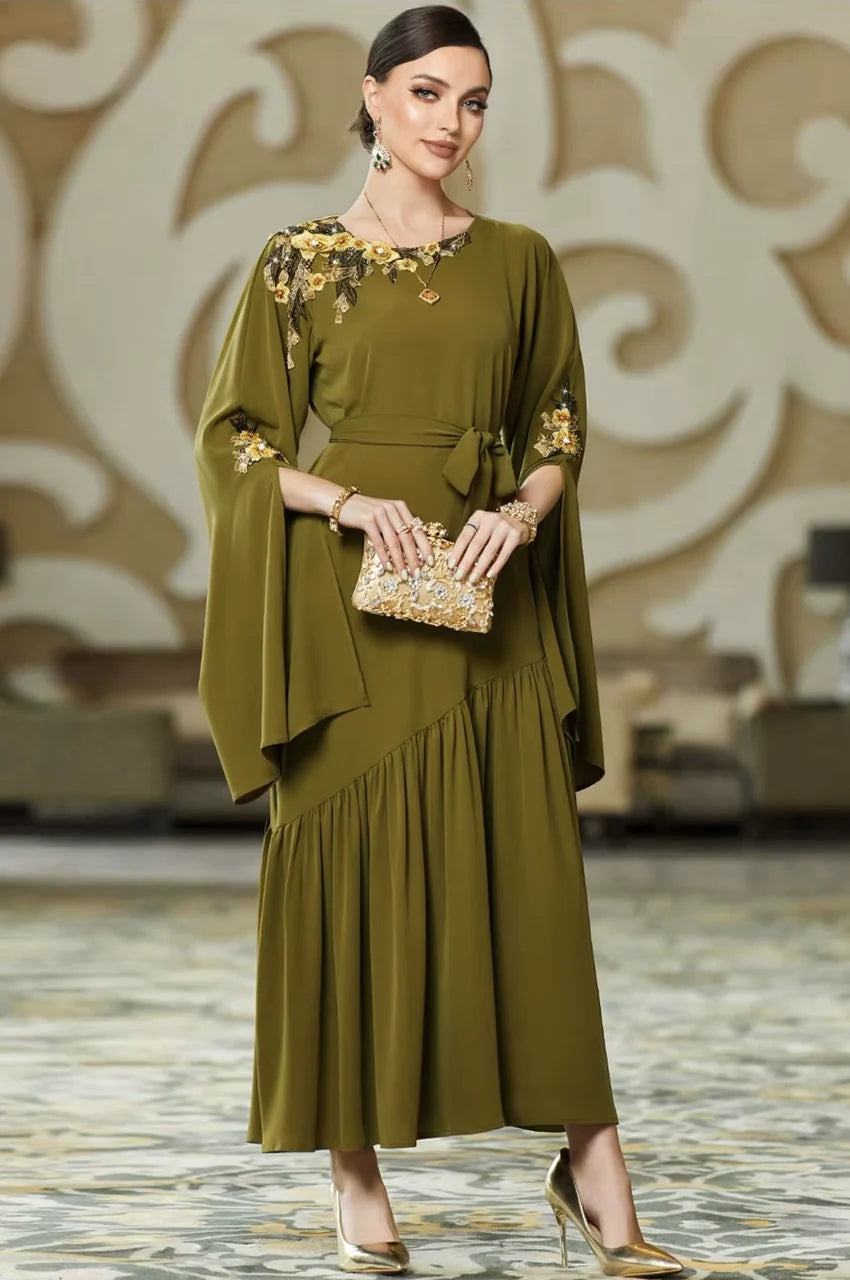 Styling inspiration for the Kairin olive green kaftan with gold accessories.