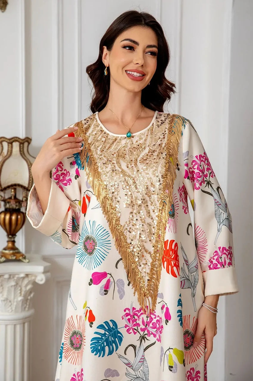 Close-up of gold sequin V-shaped panel on cream floral Kashmiri kaftan